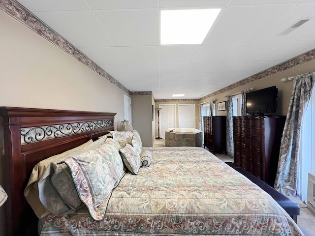 carpeted bedroom with visible vents