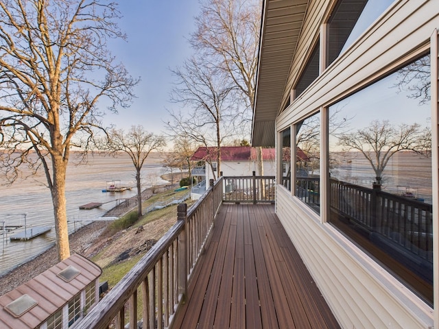 wooden terrace with a water view