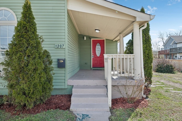 doorway to property featuring covered porch