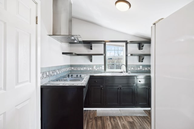 kitchen with white electric stovetop, dark wood-type flooring, vaulted ceiling, open shelves, and a sink