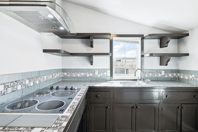 kitchen featuring black electric stovetop, a sink, vaulted ceiling, backsplash, and open shelves