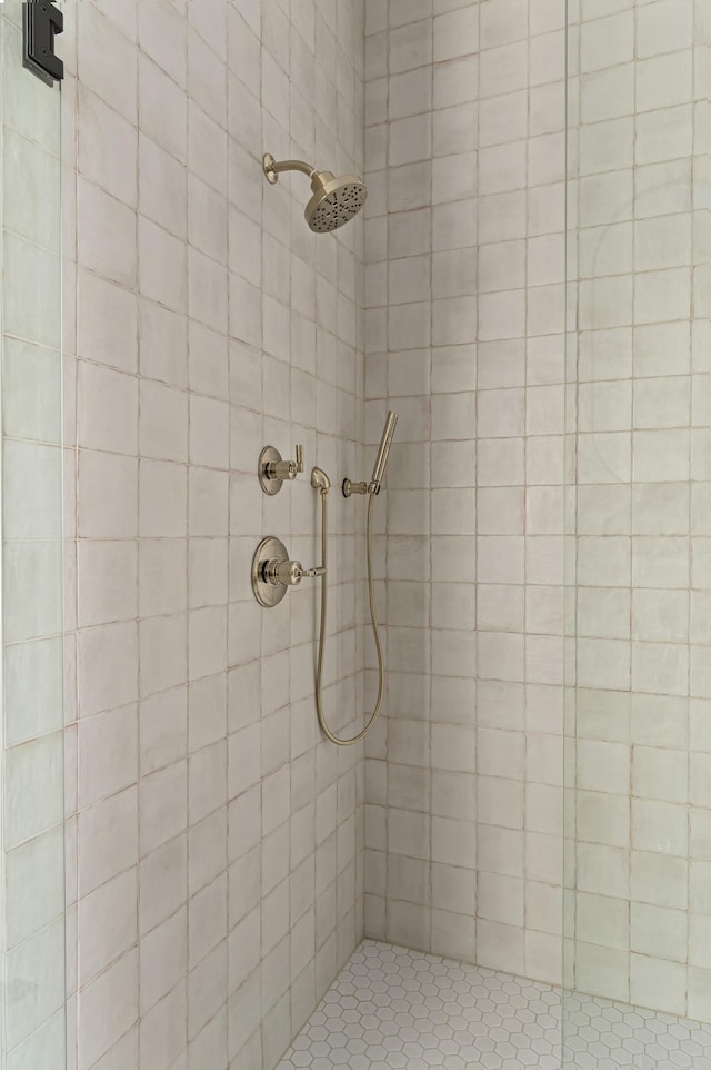 bathroom with a tile shower