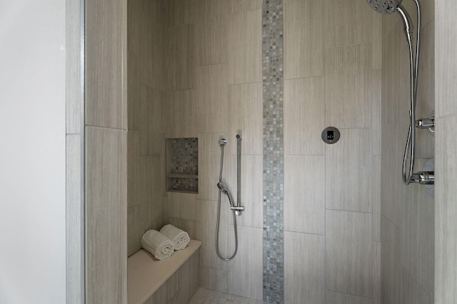 bathroom featuring tiled shower