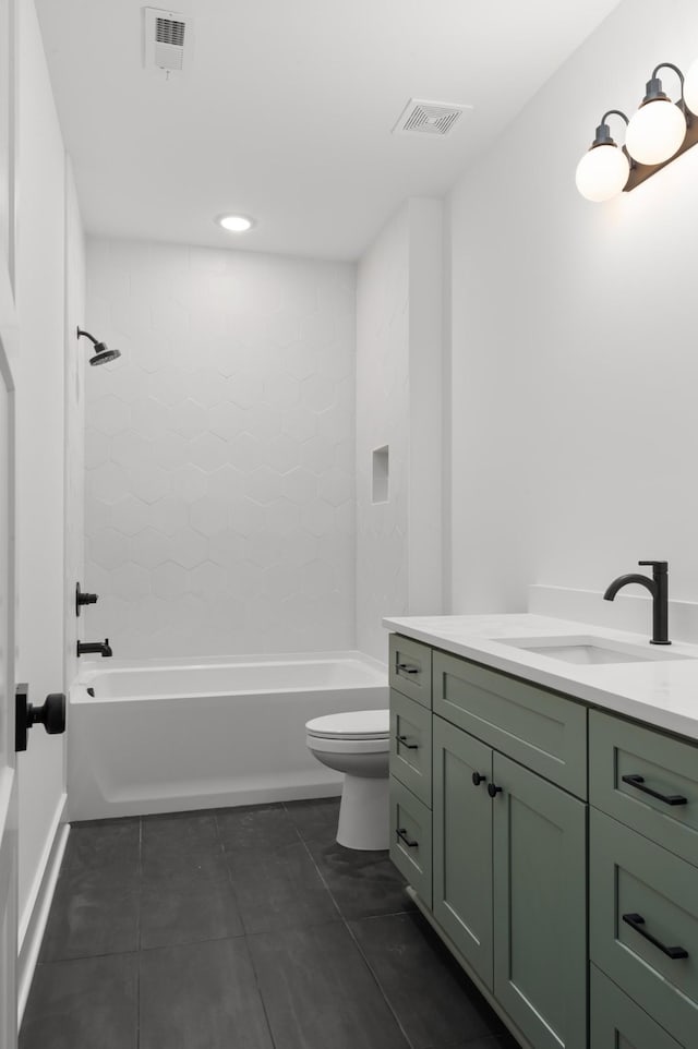 bathroom with bathing tub / shower combination, visible vents, toilet, vanity, and tile patterned floors