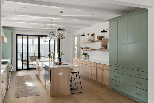 kitchen with beam ceiling, light wood-style flooring, green cabinets, and high end stainless steel range