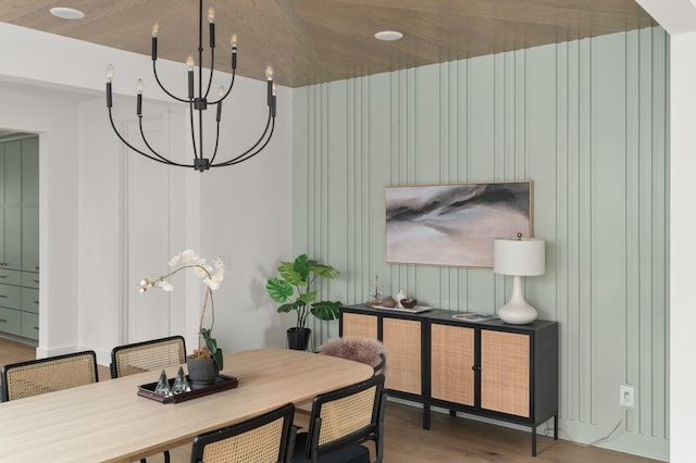 dining area featuring a chandelier and wood finished floors