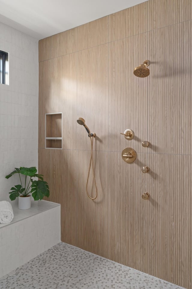 bathroom with a tile shower