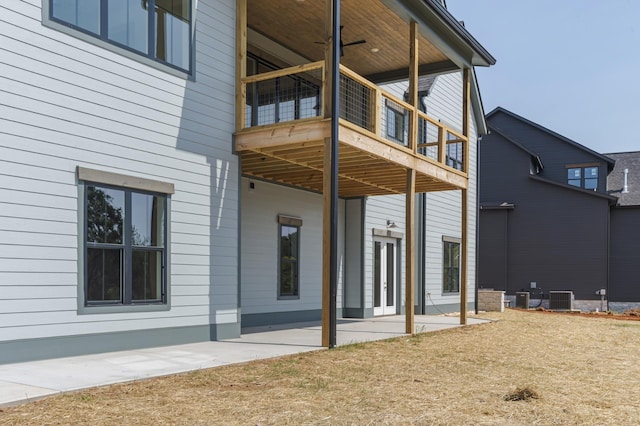 rear view of property featuring a patio and central AC unit