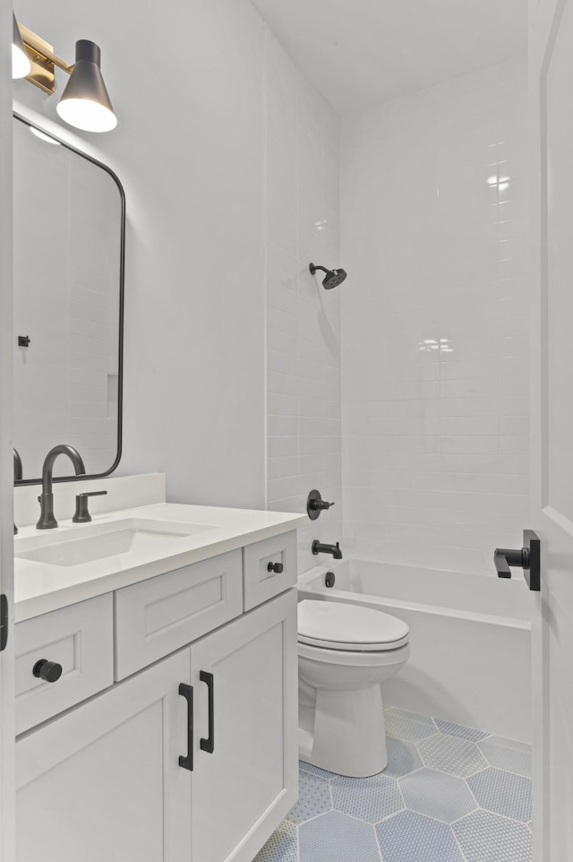 full bath with shower / bathtub combination, vanity, toilet, and tile patterned floors