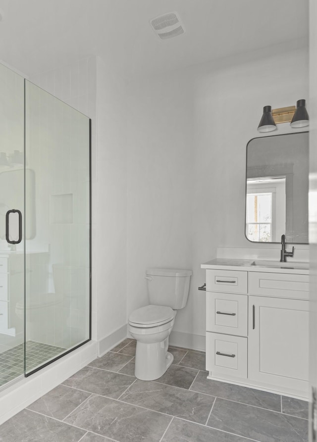 bathroom featuring visible vents, a shower stall, toilet, and vanity