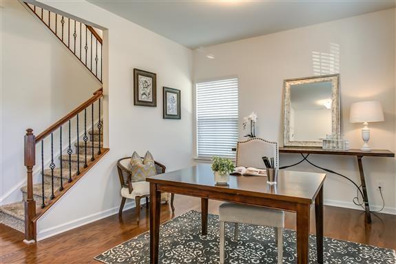 office area featuring baseboards and wood finished floors