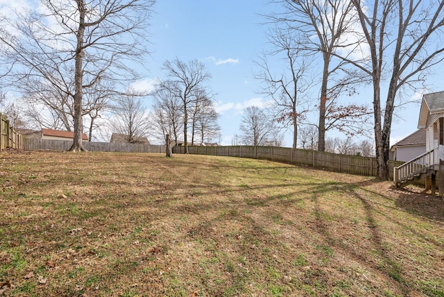 view of yard with a fenced backyard