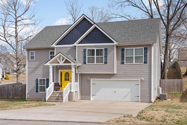 view of front of property with an attached garage, fence, concrete driveway, and roof with shingles