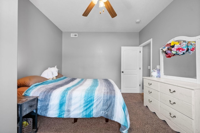 bedroom featuring carpet floors, visible vents, and ceiling fan