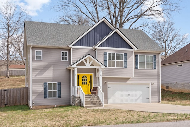 view of front of house featuring driveway, a shingled roof, fence, and board and batten siding