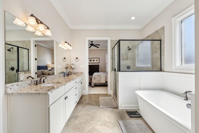 full bathroom featuring ensuite bathroom, a sink, a soaking tub, a shower stall, and crown molding