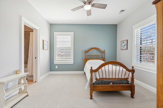 carpeted bedroom with baseboards, visible vents, and ceiling fan