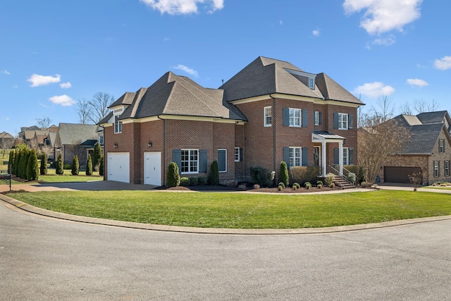 colonial home featuring brick siding, concrete driveway, roof with shingles, a residential view, and a front yard