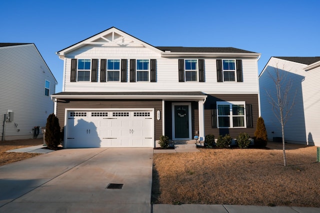 craftsman house featuring a garage and concrete driveway