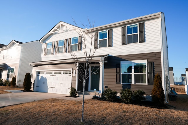 view of front of property with an attached garage and concrete driveway