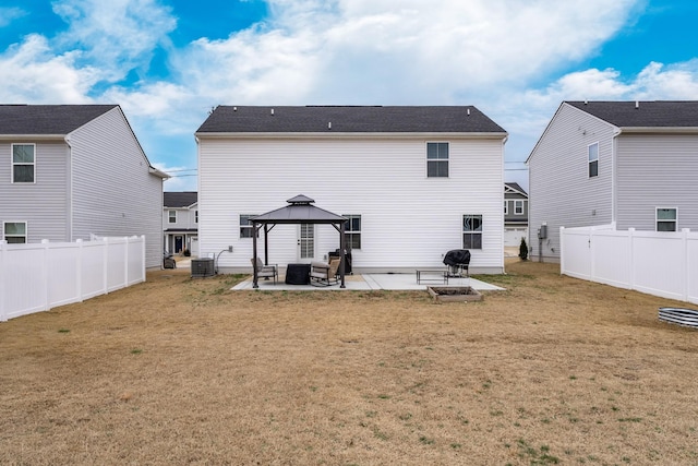 back of house with cooling unit, a patio, a gazebo, and a lawn