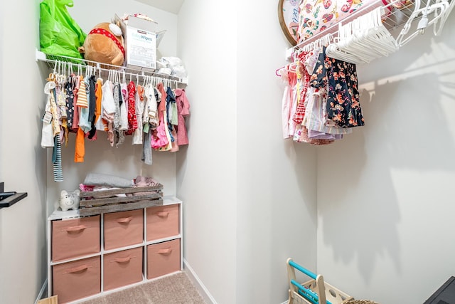 spacious closet with carpet floors