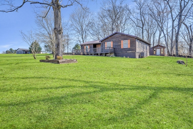view of yard featuring a wooden deck