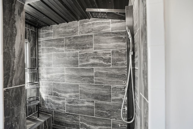 full bath with a tile shower
