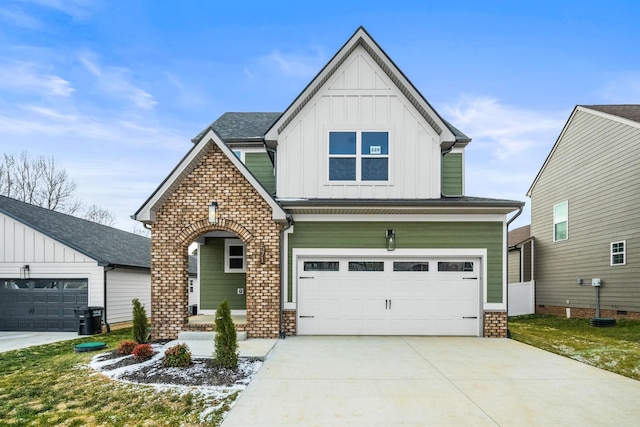 view of front of home featuring driveway, a garage, and board and batten siding