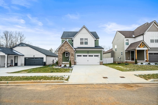 view of front of property with driveway, an attached garage, board and batten siding, and brick siding