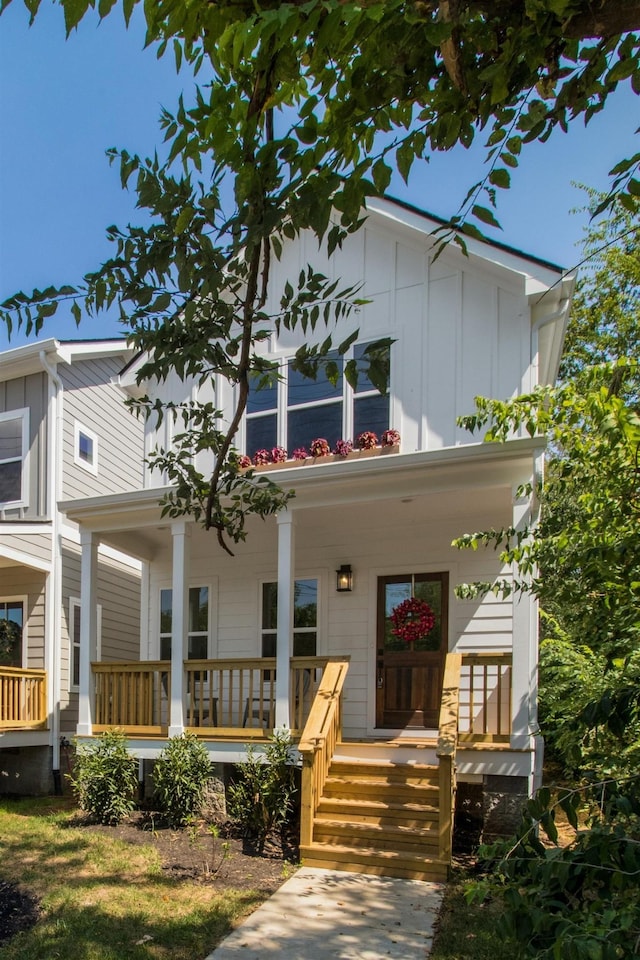 view of front of house featuring covered porch and board and batten siding