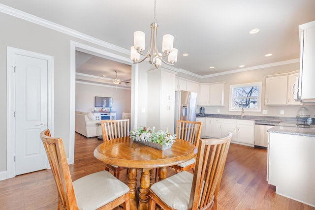 127 Odie Ray St, Gallatin, TN 37066 - dining room with light wood-style floors, recessed lighting, crown molding, and ceiling fan with notable chandelier