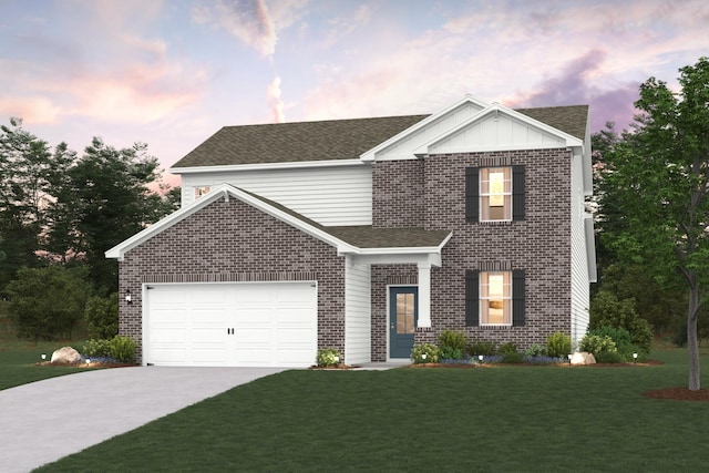 traditional home with a garage, a yard, and brick siding