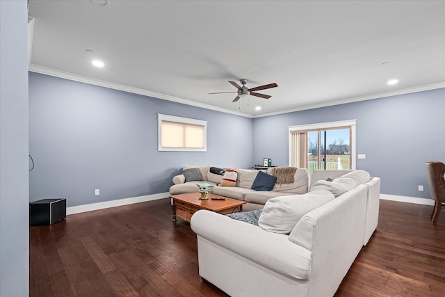 living area with baseboards, dark wood-type flooring, and ornamental molding