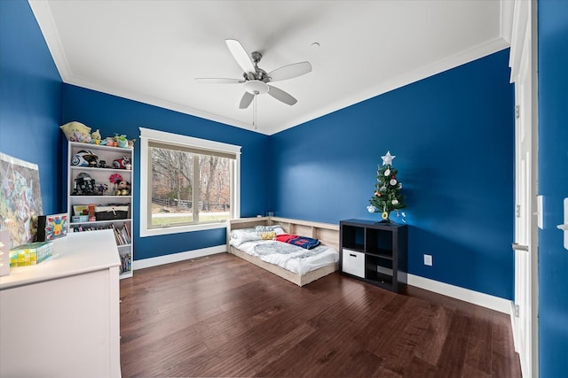 unfurnished bedroom with ceiling fan, ornamental molding, wood finished floors, and baseboards