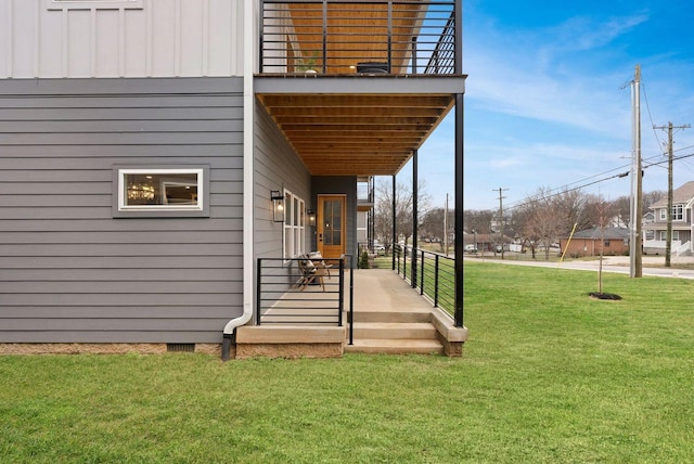 entrance to property with a yard