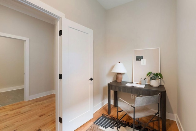 office with baseboards and wood finished floors