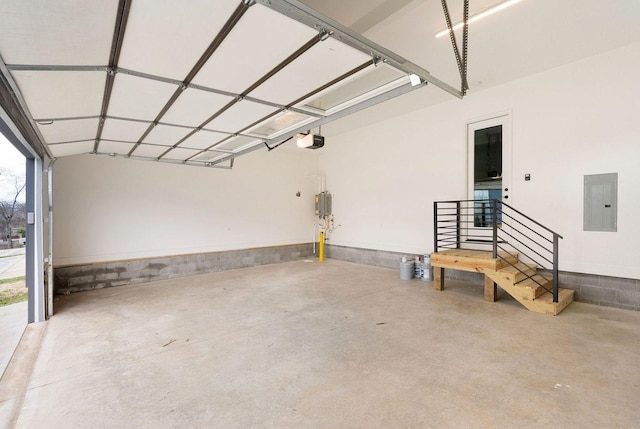 garage featuring electric panel and a garage door opener