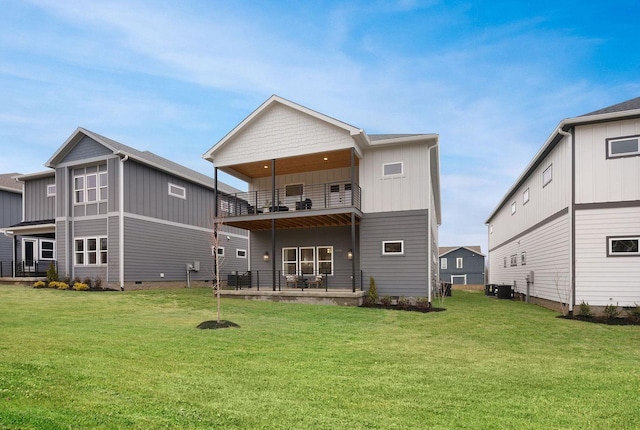 back of house featuring a balcony, central AC, a lawn, and board and batten siding