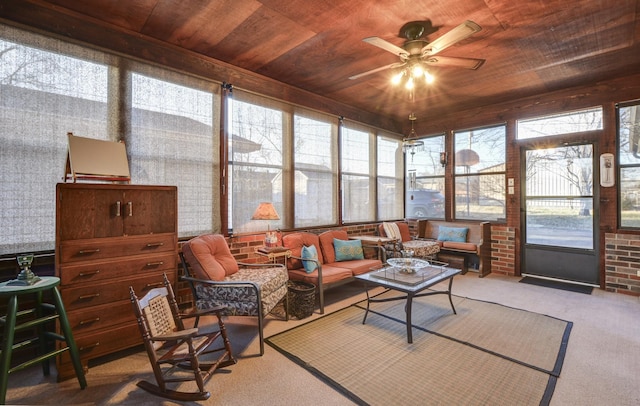 sunroom / solarium with wooden ceiling and a ceiling fan