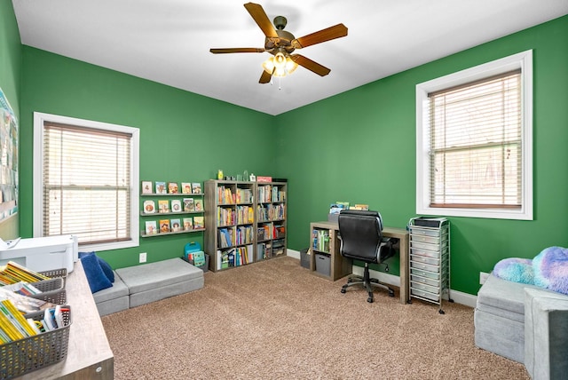 office area featuring carpet, ceiling fan, and baseboards