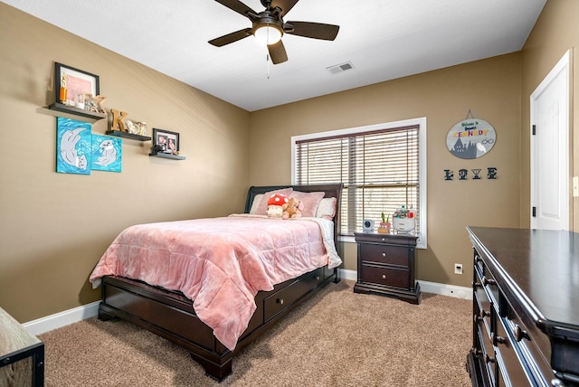 bedroom with carpet floors, baseboards, visible vents, and ceiling fan