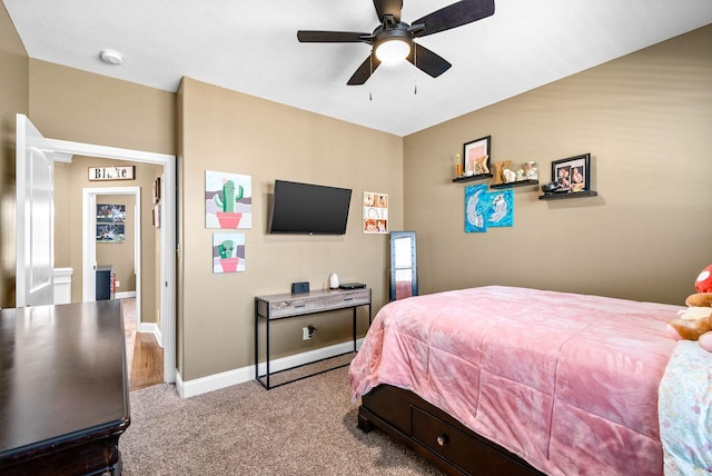 carpeted bedroom featuring a ceiling fan and baseboards