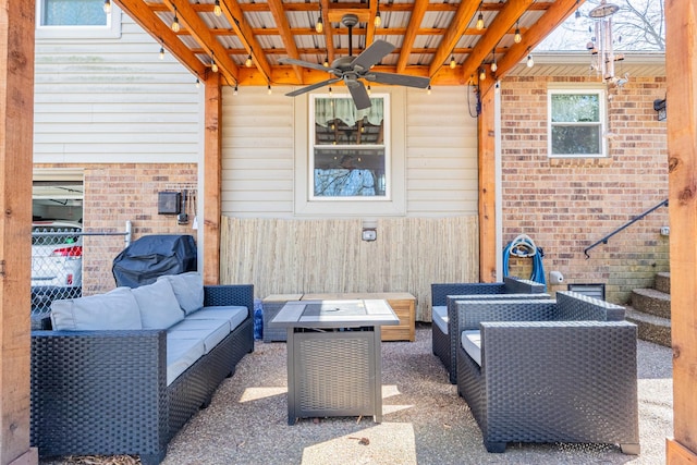 view of patio with an outdoor living space and a ceiling fan