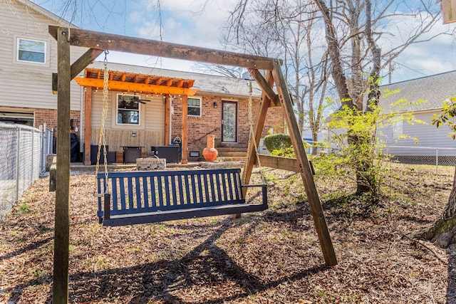 back of property featuring a fenced backyard and brick siding