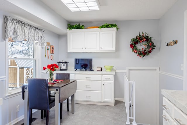 kitchen featuring light countertops and white cabinetry