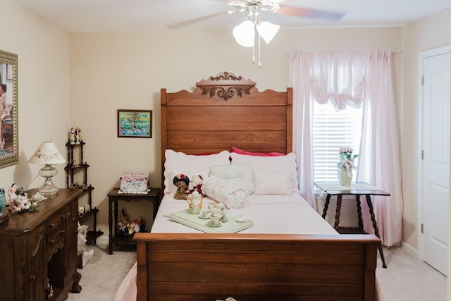 carpeted bedroom with a ceiling fan