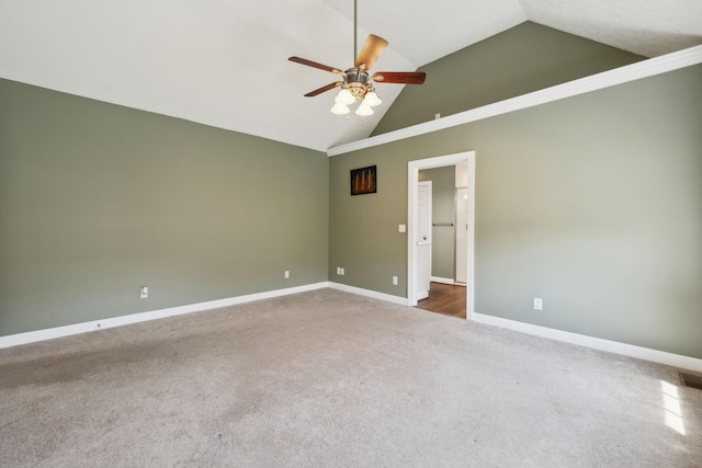 carpeted spare room featuring baseboards, high vaulted ceiling, and ceiling fan