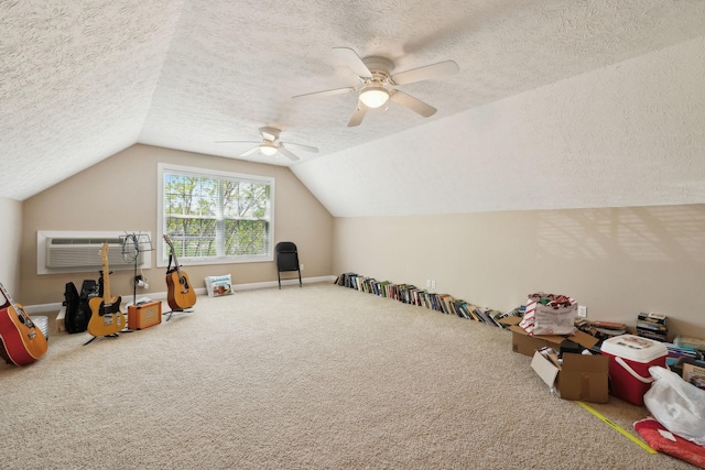 playroom with a textured ceiling, ceiling fan, carpet flooring, and vaulted ceiling