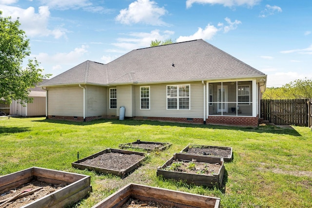 rear view of house featuring roof with shingles, a garden, and crawl space